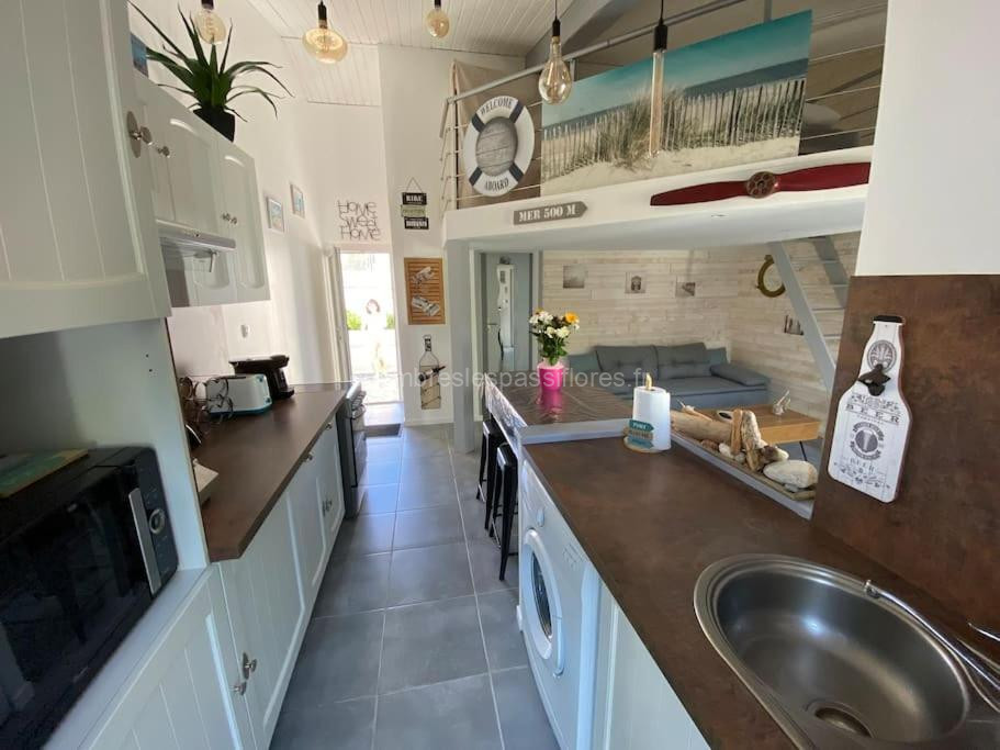 Photo de Agréable maison, plage à 400m, jardin, piscine et tennis